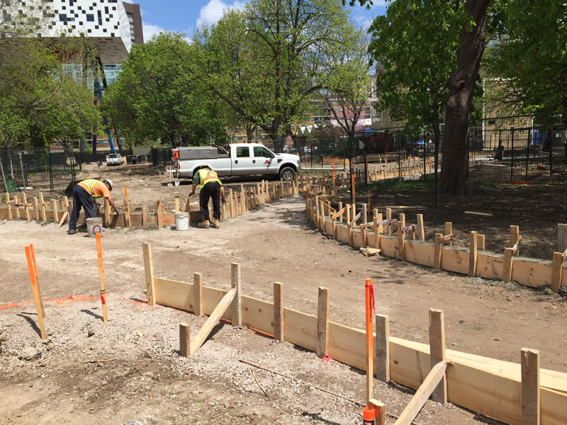 May 16, 2016 – Pouring curbs for the east-west path