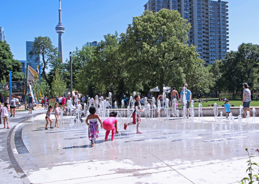 Children running through the splash pad