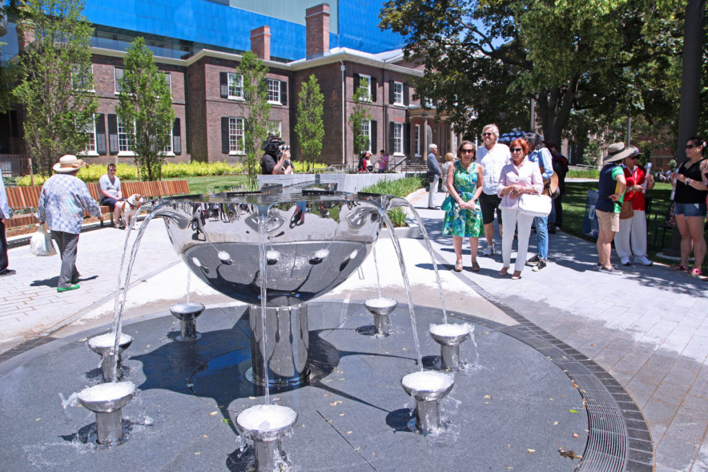 People admiring the new water feature